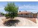 Single-level home with a charming yard and circular driveway with low maintenance landscaping at 6126 N 31St Dr, Phoenix, AZ 85017