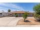 Charming single-level home featuring a covered carport and circular driveway at 6126 N 31St Dr, Phoenix, AZ 85017