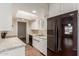 This kitchen features white cabinets, granite countertops, and a stainless steel refrigerator at 6126 N 31St Dr, Phoenix, AZ 85017