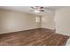 Spacious living room featuring a ceiling fan and wood-look flooring at 6126 N 31St Dr, Phoenix, AZ 85017