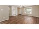 Inviting living room features stylish wood-look flooring, built-in shelving, and neutral wall color at 6126 N 31St Dr, Phoenix, AZ 85017