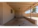 Covered patio with brick columns, brick wall, a concrete floor, and white ceiling beams at 6126 N 31St Dr, Phoenix, AZ 85017