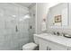 Elegant white bathroom features a marble countertop vanity and a frameless glass shower at 614 N Pioneer Cir, Mesa, AZ 85203