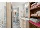 Bathroom featuring a vanity with marble countertop and a view of a separate powder room at 614 N Pioneer Cir, Mesa, AZ 85203