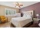 Stylish bedroom with a modern upholstered bed and a neutral color palette at 614 N Pioneer Cir, Mesa, AZ 85203