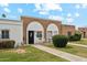 Charming single-story brick home featuring a well-manicured lawn and inviting front entry at 614 N Pioneer Cir, Mesa, AZ 85203