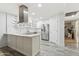 Bright kitchen with modern island, stainless steel appliances, and ample cabinet space at 614 N Pioneer Cir, Mesa, AZ 85203