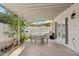 Covered patio with an outdoor dining set, perfect for relaxing and entertaining guests at 614 N Pioneer Cir, Mesa, AZ 85203