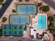 Overhead aerial view of tennis and pickleball courts alongside a large swimming pool with lap lanes and lounge area at 6162 E Redmont Dr, Mesa, AZ 85215