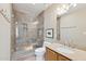 Bathroom features a glass enclosed shower with decorative tile and granite vanity at 6162 E Redmont Dr, Mesa, AZ 85215