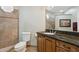 Bathroom features tile flooring, granite countertops, and decorative mirror at 6162 E Redmont Dr, Mesa, AZ 85215
