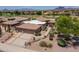 Beautiful desert home with tile roof, three car garage, and manicured landscaping with mountain views at 6162 E Redmont Dr, Mesa, AZ 85215