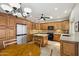 Well-equipped kitchen features wood cabinets, granite countertops, tile floors, and stainless steel appliances at 6162 E Redmont Dr, Mesa, AZ 85215
