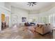 Open living space with tile flooring, neutral paint, arched entryways, and ample seating for entertaining at 6162 E Redmont Dr, Mesa, AZ 85215