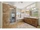Comfortable main bathroom with a shower, separate tub, and dual sinks with backyard views at 6162 E Redmont Dr, Mesa, AZ 85215