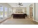 Cozy main bedroom features a ceiling fan, french doors to the pool area, and neutral paint at 6162 E Redmont Dr, Mesa, AZ 85215