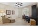 Cozy office space with carpet, neutral walls, wood desk and chair and corner windows at 6162 E Redmont Dr, Mesa, AZ 85215