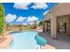 Beautiful backyard pool with lush landscaping and a view of the golf course at 6162 E Redmont Dr, Mesa, AZ 85215