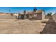 Exterior view of a house with an open patio and backyard space at 7506 W Sells Dr, Phoenix, AZ 85033