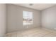 This bedroom features neutral paint and tile flooring, creating a clean and bright space at 7506 W Sells Dr, Phoenix, AZ 85033