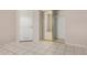 Spacious bedroom featuring tiled flooring and a mirrored closet for ample storage space at 7506 W Sells Dr, Phoenix, AZ 85033