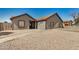 Inviting single-story home with desert landscaping and a pathway to the front door at 7506 W Sells Dr, Phoenix, AZ 85033