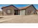 Attractive single-story home featuring desert landscaping and a covered front porch at 7506 W Sells Dr, Phoenix, AZ 85033