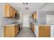 Bright kitchen with wooden cabinets, stainless steel appliances, and gray subway tile backsplash at 7506 W Sells Dr, Phoenix, AZ 85033