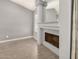 Cozy living room featuring a charming fireplace and neutral paint color at 7506 W Sells Dr, Phoenix, AZ 85033