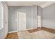 A spacious room with dual entry points, tile flooring and neutral paint at 7506 W Sells Dr, Phoenix, AZ 85033