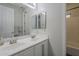 Well-lit bathroom with double sinks, modern fixtures, and a separate shower/tub area at 797 E Cedar Dr, Chandler, AZ 85249