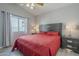 Bedroom with a window, bed and nightstand. The floors are wood like at 797 E Cedar Dr, Chandler, AZ 85249