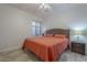 Cozy bedroom with hardwood floors, a ceiling fan, and a window at 797 E Cedar Dr, Chandler, AZ 85249