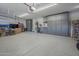 Well-organized garage with epoxy flooring and custom storage cabinets offers functionality and a clean aesthetic at 797 E Cedar Dr, Chandler, AZ 85249