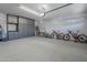 Spacious garage features epoxy flooring, storage cabinets, and ample space for vehicles and storage at 797 E Cedar Dr, Chandler, AZ 85249