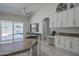 Stylish kitchen with a center island, a ceiling fan, and stainless steel appliances at 797 E Cedar Dr, Chandler, AZ 85249