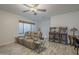Comfortable living room area with plush reclining seating, stylish tables, and unique arcade game machines at 797 E Cedar Dr, Chandler, AZ 85249
