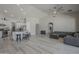 Open-concept living area with modern decor, fan, ample seating, and seamless kitchen access at 797 E Cedar Dr, Chandler, AZ 85249
