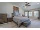 Cozy bedroom features neutral colors, a ceiling fan, and a window seating area at 797 E Cedar Dr, Chandler, AZ 85249