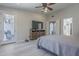 Bright main bedroom boasts neutral tones, TV, and direct access to an outdoor seating area at 797 E Cedar Dr, Chandler, AZ 85249