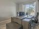 Bright home office with a large window, hardwood floors, and a contemporary desk at 797 E Cedar Dr, Chandler, AZ 85249
