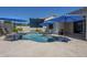 Inviting pool area features a uniquely shaped pool, tiled patio, and sun umbrellas at 797 E Cedar Dr, Chandler, AZ 85249