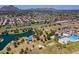 An aerial view of a community park with pool, lake, playgrounds and recreational areas for outdoor activities at 8301 E Indianola Ave, Scottsdale, AZ 85251
