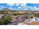 Aerial view showcasing city landmarks, a mountain backdrop, businesses, and the neighborhood surrounding the property at 8301 E Indianola Ave, Scottsdale, AZ 85251