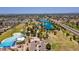 An aerial view of a community park with pool, lake, playgrounds and recreational areas for outdoor activities at 8301 E Indianola Ave, Scottsdale, AZ 85251