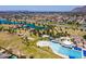 An aerial view of a community park with pool, lake, playgrounds and recreational areas for outdoor activities at 8301 E Indianola Ave, Scottsdale, AZ 85251