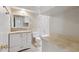 Bright bathroom with updated fixtures, vanity storage, and neutral tile, offering a clean and functional design at 8301 E Indianola Ave, Scottsdale, AZ 85251