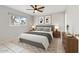 A bright bedroom featuring a neutral color palette and a patterned rug beneath the bed at 8301 E Indianola Ave, Scottsdale, AZ 85251