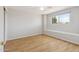 Bright bedroom with a sunny window seat and laminate wood floors, providing a cozy and comfortable atmosphere at 8301 E Indianola Ave, Scottsdale, AZ 85251