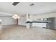 Modern kitchen featuring stainless steel appliances, granite countertops, white cabinetry, recessed lighting, and tile floors at 8301 E Indianola Ave, Scottsdale, AZ 85251